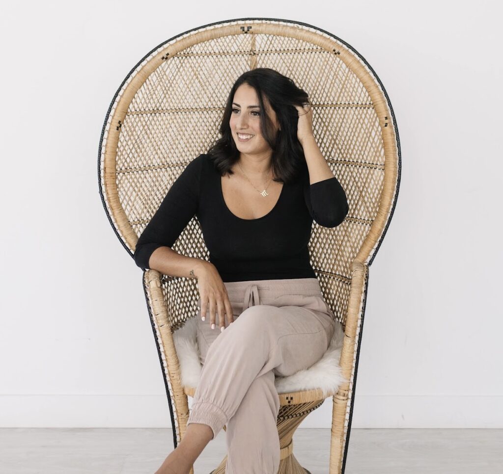 maria posing in a stylish chair